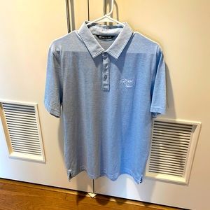 Travis Mathew Mens Large Light Blue stripe polo with Gamble Sands golf logo.